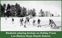 Students playing hockey on Ashely pond